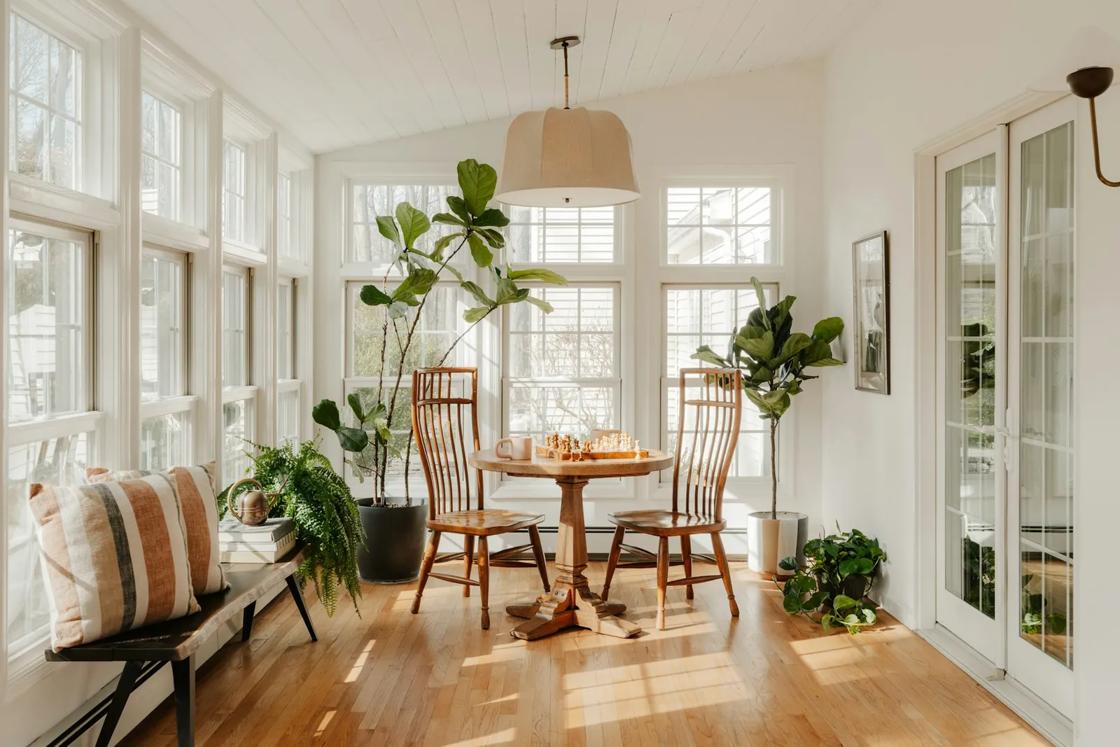 A bright, sunlit dining room cleaned to perfection
